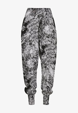 Melni brīvā laika bikses ar baltu abstraktu rakstu, elastīgu jostasvietu un saspringtām potītēm. Izgatavotas no mīksta, viegla auduma.