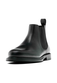 Schwarze Leder-Chelsea-Boots mit glatter Oberfläche, gerundeter Zehenpartie, elastischen Seitenpaneelen und einer Zugschlaufe für einfaches Anziehen. Flacher, niedriger Absatz.