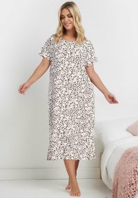 CAMICIA DA NOTTE A MANICHE COURTE, LUNGHEZZA AL GINOCCHIO, IN COTONE SOFFICE CON FONDO ROSA E MACULATURA LEOPARDO NERA E MARRONE. COLLO ROTONDO, VESTIBILITÀ LARGA.