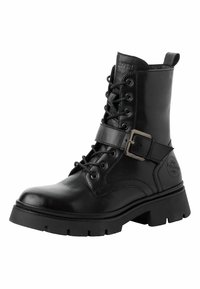 Botte de combat en cuir noir avec devant à lacets, sangle réglable et boucle en métal, surface texturée et semelle en caoutchouc avec un profil accrocheur.