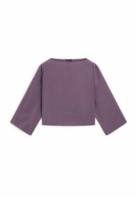 Haut court en tissu violet clair avec une coupe décontractée, manches larges et encolure ronde. Texture lisse avec des détails de design minimalistes.