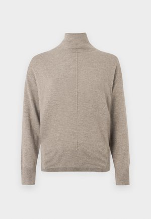 Μπεζ πουλόβερ μεζονέτα με ριμπ τελείωμα στη μέση και στους μανσέτες, διαθέτει διακριτική υφή και λεπτομέρεια κεντρής ραφής στο πίσω μέρος.