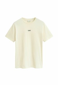 T-shirt beige a maniche corte con colletto tondo e piccolo logo nero "GANT" centrato sul petto.