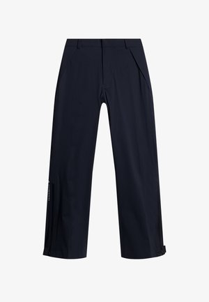 Pantaloni outdoor blu navy realizzati in tessuto leggero e resistentente all'acqua. Presentano tasche laterali e cerniere alle caviglie per la ventilazione.