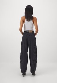 adidas Originals Široke nogavice - black