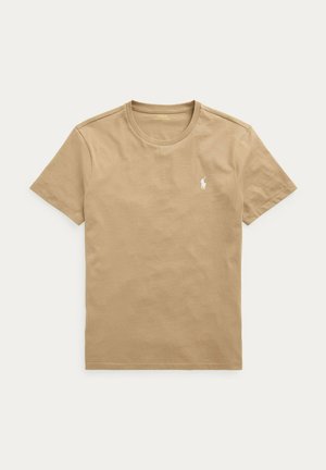T-shirt beige a maniche corte con scollo tondo e piccolo logo bianco Polo Ralph Lauren ricamato sul petto sinistro.