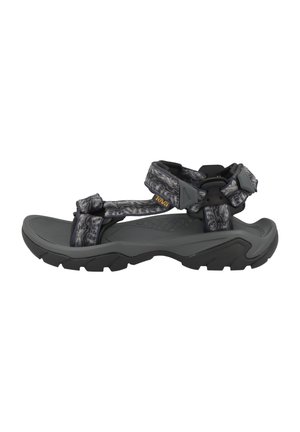 Grå og sort udendørs sandal med robust sål og justerbare mønstrede remme, designet til komfort og holdbarhed.