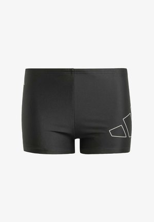 Bañador negro con textura suave, con un patrón geométrico blanco en el lateral y un diseño ajustado para mayor comodidad y soporte.