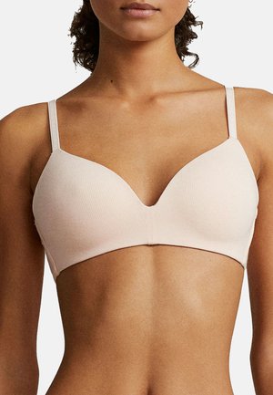 Bralette ribeteado de color rosa claro con un escote en V profundo, tirantes delgados ajustables y un tejido de textura suave. Diseño simple y sin costuras.