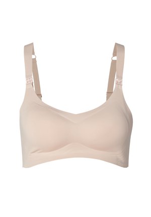 Beige wireless bra with smooth fabric, wide straps, and adjustable hardware, featuring a seamless design and soft texture.