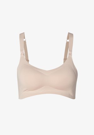 Beige drahtloser BH aus glattem Stoff, mit breiten Trägern und verstellbarem Zubehör, das ein nahtloses Design und eine weiche Textur aufweist.