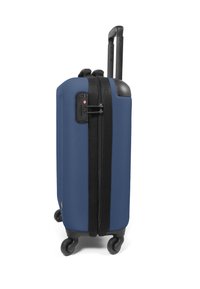 Blue hard-shell suitcase with a textured surface, two wheels, retractable handle, and black zipper detailing with a combination lock.