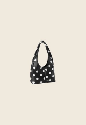 Black shoulder bag with large white polka dots, curved top handle, and "House of Sunny" logo near the bottom.