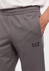 EA7 Emporio Armani TRAIN CORE PANTS - Spodnji deli trenirk - volcanic glass