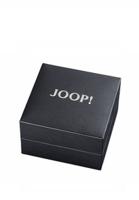 Schwarze, strukturierte Box mit einer glatten Oberfläche und silbernem "JOOP!"-Logo auf der Oberseite. Quadratische Form, keine sichtbaren Beschläge oder Akzente.