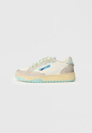 Sneakers featuring a mix of light gray and cream suede with a textured mint green outsole; blue "Arizona Love" branding on the side.