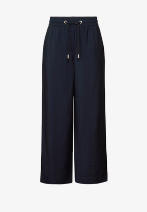 Granatowe spodnie typu wide-leg z fakturowanej tkaniny, z elastycznym paskiem w talii i regulowanym sznurkiem zakończonym złotymi metalowymi końcówkami.