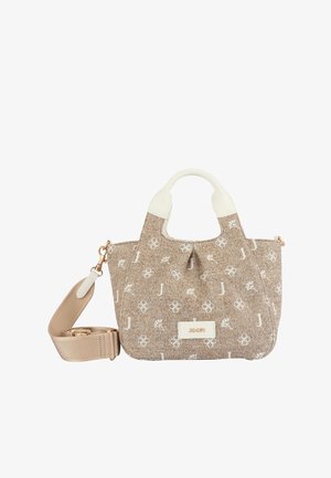 Sac à main en tissu beige avec motifs floraux blancs et lettres, poignées blanches, ferrures dorées et une grande bandoulière beige amovible.