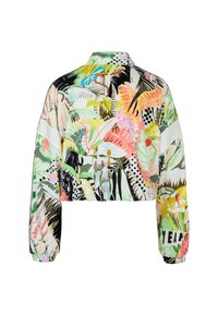 Cropped jacket with colorful tropical leaf and animal prints, featuring long sleeves and a ribbed hem. Lightweight, shiny fabric.