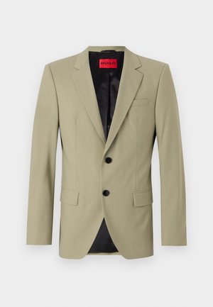 Light green blazer with notch lapels, two black buttons, and a chest pocket. Features a contrasting black satin lining.