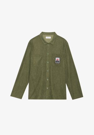 Olive green corduroy shirt with long sleeves, button closure, two chest pockets, and a mountain graphic patch on the left pocket.