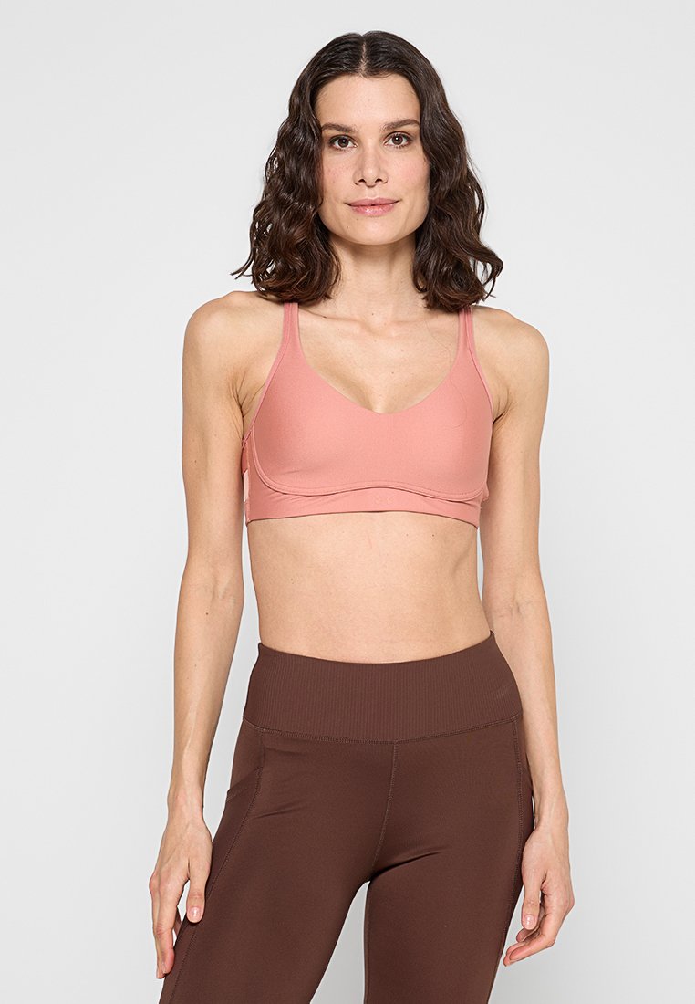 Under Armour Sport-bh met light support donkerroze Under Armour Sport-bh met light support donkerroze