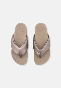 Metallic taupe flip-flops with a cross-band design, soft fabric upper, and beige contoured footbed. Logo embossed on footbed.