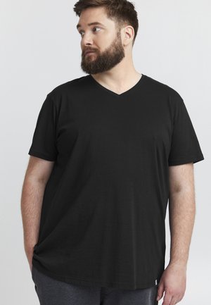 Black cotton t-shirt with a v-neck, short sleeves, relaxed fit, and a smooth texture. Notable detail includes a small logo tag at the hem.