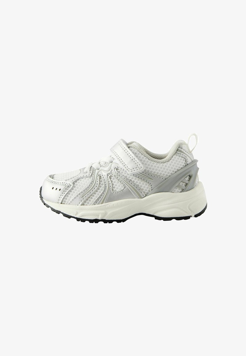 White athletic shoe with mesh upper and silver accents. Features a Velcro strap, curved design, and textured rubber sole for grip.