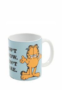 Tazza in ceramica con uno sfondo azzurro chiaro, caratterizzata da un gatto arancione con un'espressione da cartone animato, con la scritta "NON SO. NON MI INTERESSA."