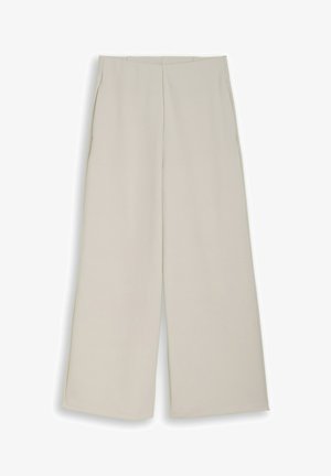 Beżowe spodnie o szerokich nogawkach z wysokim stanem i detalem w postaci szwu z przodu, przedstawione na płasko na białym tle.