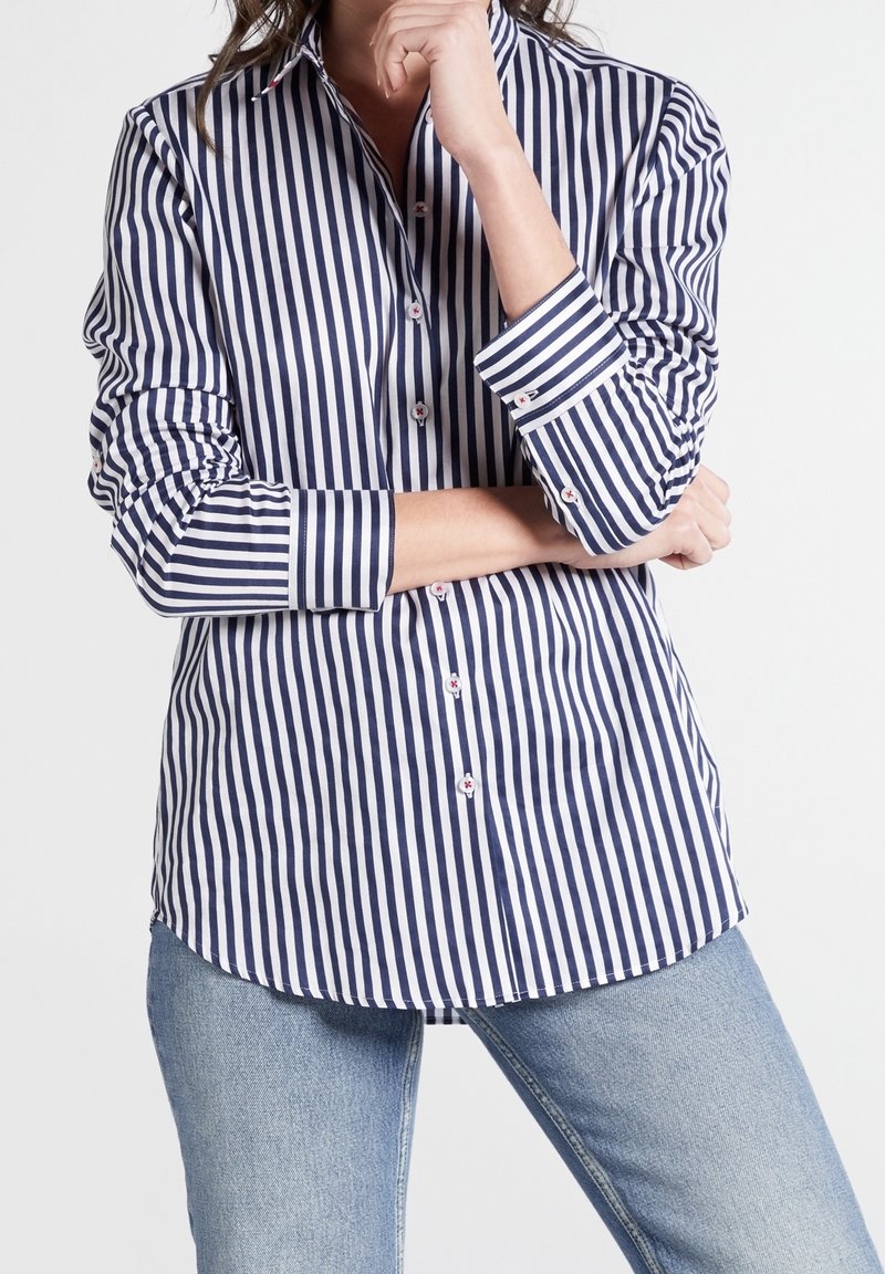 Navy and white striped button-up shirt with long sleeves, featuring a classic collar and small floral accents on buttons and cuffs.