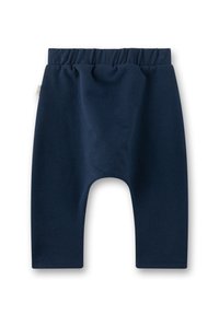 Marineblaue Baumwoll-Hosen für Kinder mit einem dehnbaren, gerüschten Bund und schmal zulaufenden Beinen. Glatte Textur, keine sichtbaren Muster oder Beschläge.