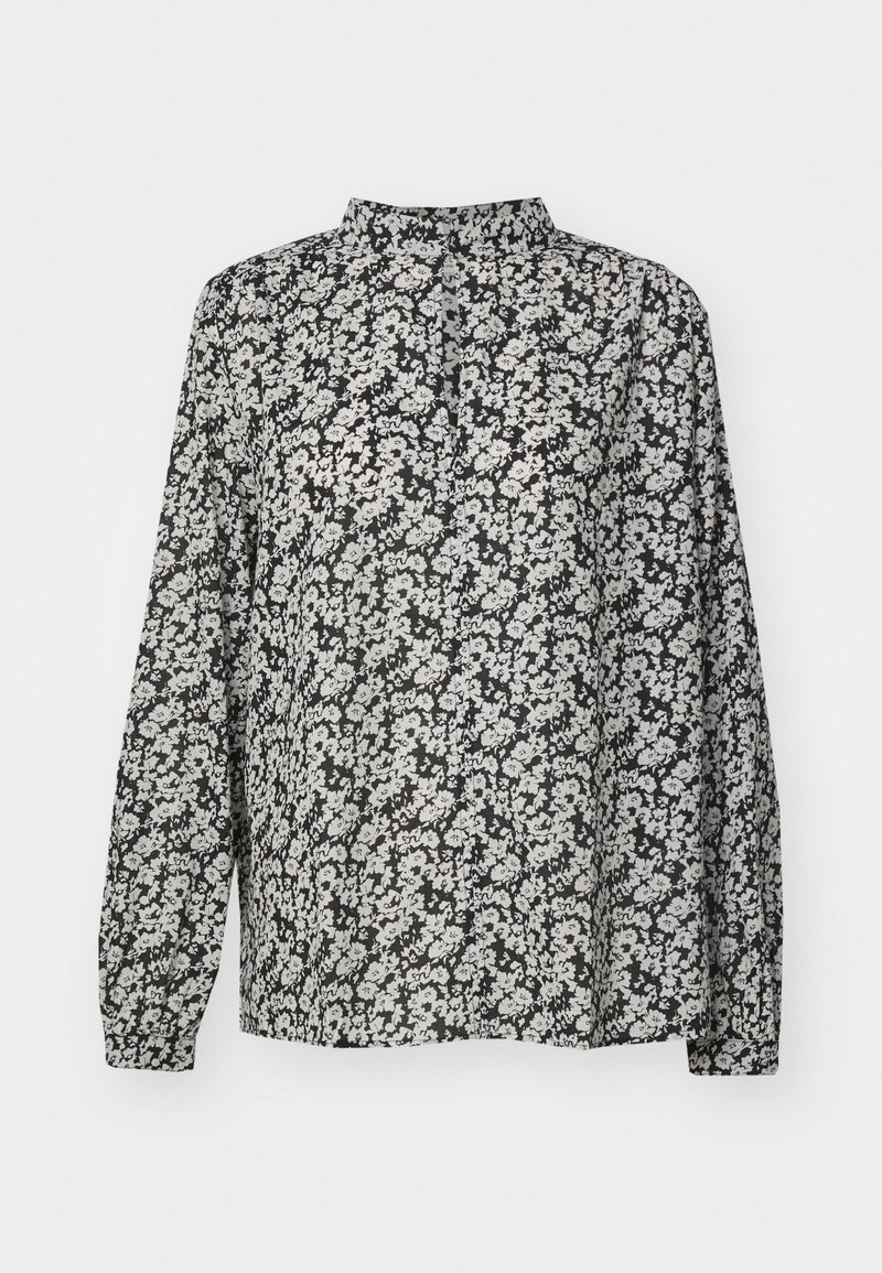 Blusa nera a fiori con maniche lunghe, colletto alto e un tessuto leggero e texture con motivi floreali bianchi e grigi.