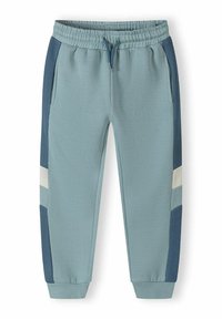Vaaleansiniset jogginghousut, jotka on valmistettu pehmeästä puuvillasta; sisältävät naru vyötärön, sivutaskut ja väriblokkipdesignin tummansinisillä yksityiskohdilla.