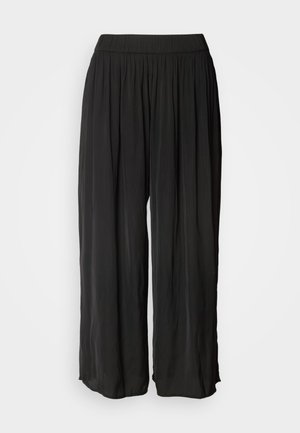 Melnas, plašas bikses, kas izgatavotas no viegla auduma, ar plecu dizainu un elastīgu jostu ērtībai un viegliem valkāšanai.