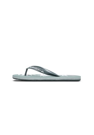 Green flip-flop with textured upper, thin strap, and white logo. Features a patterned sole with grooves for grip. Lightweight design.