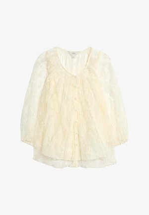 Kantenn boven met korte pofmouwen, crème kleur, voorzien van bloemige borduursels, knopen met voorkant en een ronde halslijn met een geplooid lijfje.