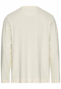 Lange mouwen crème katoenen shirt met een ronde halslijn, een soepele textuur en een rechte zoom. Geen zichtbare patronen of accenten.