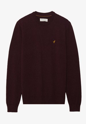 Maglione bordeaux con scollo tondo, maniche lunghe, polsini e orlo a coste. Presenta un piccolo logo di un uccellino giallo sul petto sinistro. Texture morbida.