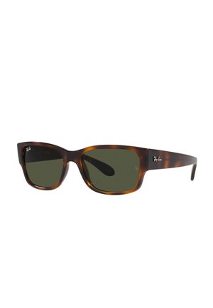 Occhiali da sole tartaruga marrone con lenti verdi, design a occhiale quadrato oversize e un branding sottile sulla tempia. Texture liscia.