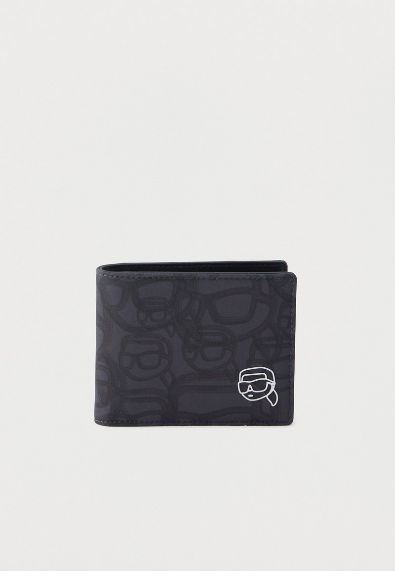 Must musta, millel on musta musta musta musta musta musta ja patternit musiķ. Must on valge graafika detail, mis esindab nägu, millel on prillid ja bandana.