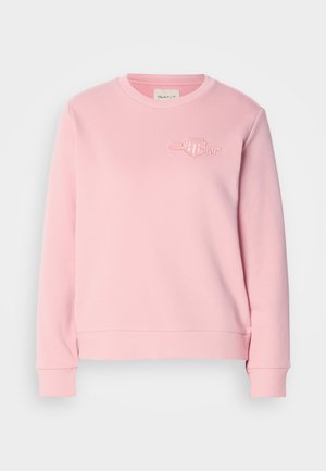 Light pink crewneck sweatshirt with long sleeves and subtle embroidered logo on left chest, ribbed cuffs, and waistband.