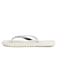 White flip-flop sandal with a braided rope sole and metallic straps, featuring a sleek, minimalistic design and smooth texture.