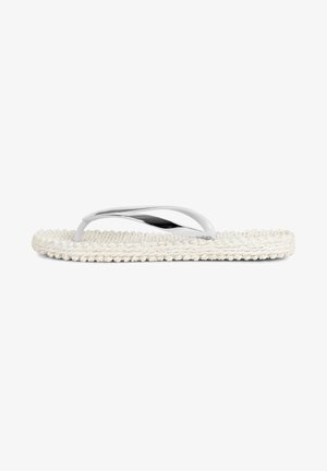 White flip-flop sandal with a braided rope sole and metallic straps, featuring a sleek, minimalistic design and smooth texture.