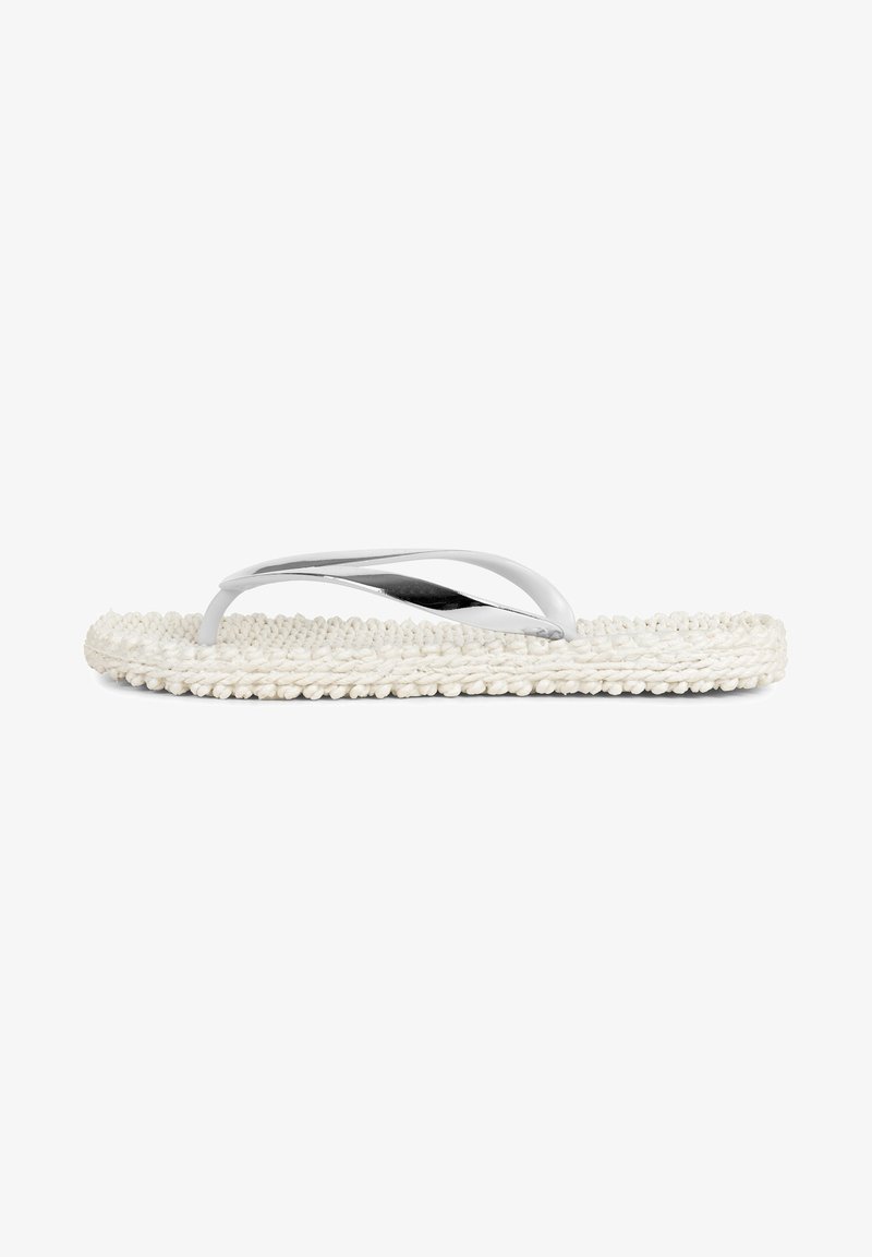 White flip-flop sandal with a braided rope sole and metallic straps, featuring a sleek, minimalistic design and smooth texture.