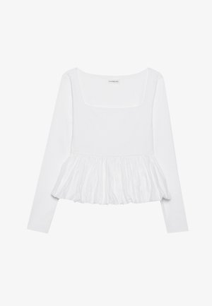White long-sleeve top with a square neckline, featuring a gathered peplum hem made of textured fabric. Labels visible at the neck.