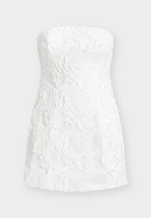 White strapless dress featuring layered floral embroidery, textured fabric, fitted shape, and a smooth, slightly glossy finish.
