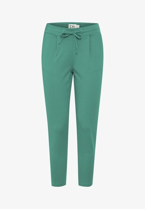 Turkooise joggingbroek met een gladde textuur, elastische tailleband, trekkoord en twee voorzakken; taps toelopend ontwerp.