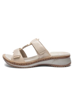 Beež avatud varbaga sandaal kahe reguleeritava rihmaga, pehmendusega sisetald ning tekstuuriga kiilkonts vabaajajalanõudeks.